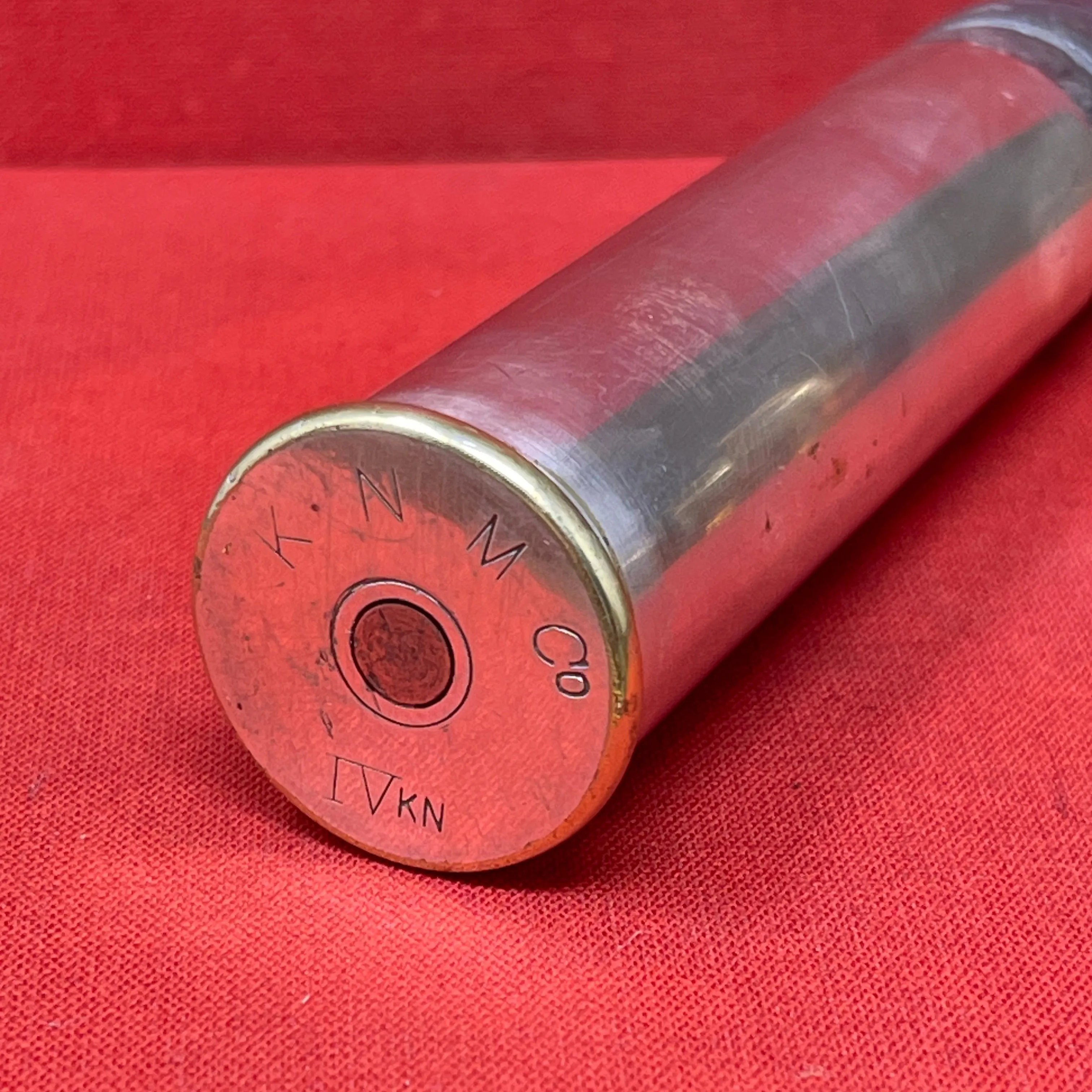 An Inert British Mark V M ( Morris) artillery 1" aiming rifle cartridge